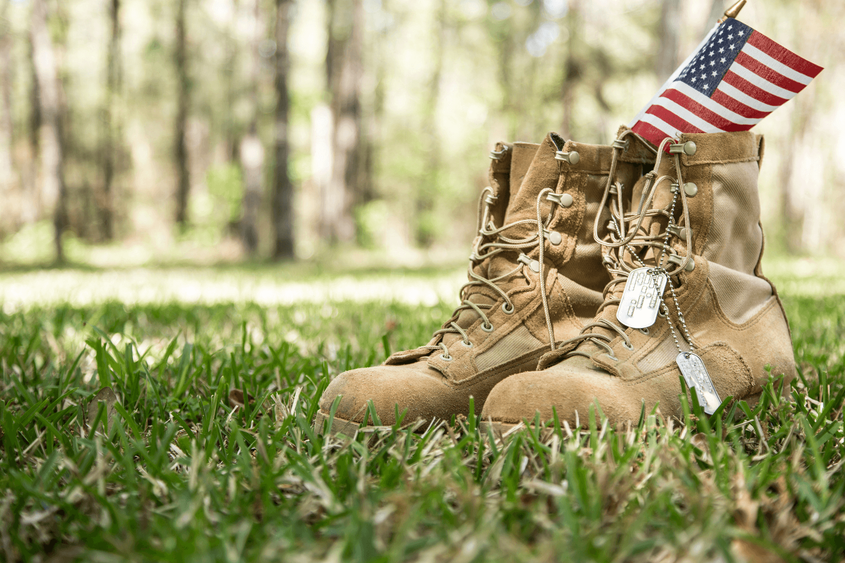 Military boots, dog tags, and an American flag